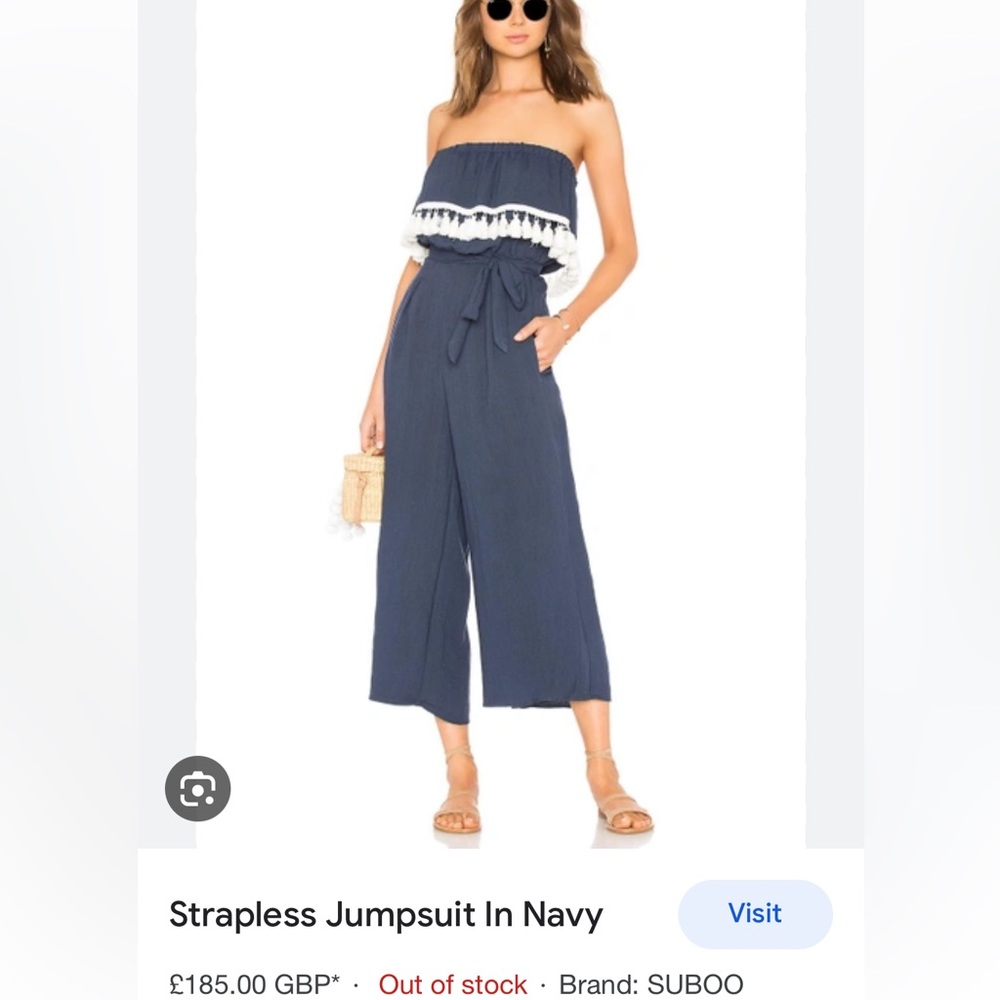 Small navy strapless jumpsuit with tassels